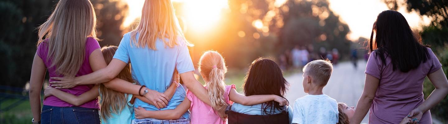 Children enjoying the sunset together