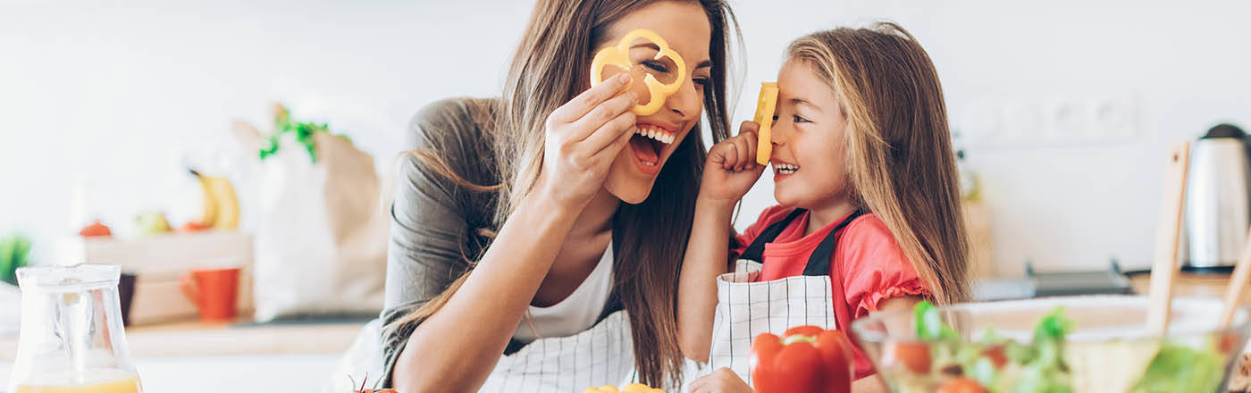 mother and daughter cooking healthy meal