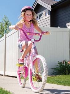 Photo of Olivia, riding her bike.