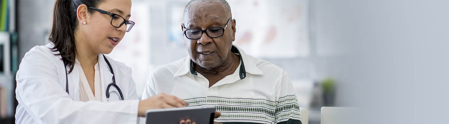 provider sharing view of tablet with patient