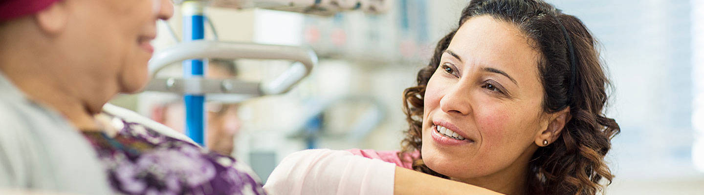 Holding cancer patient hand