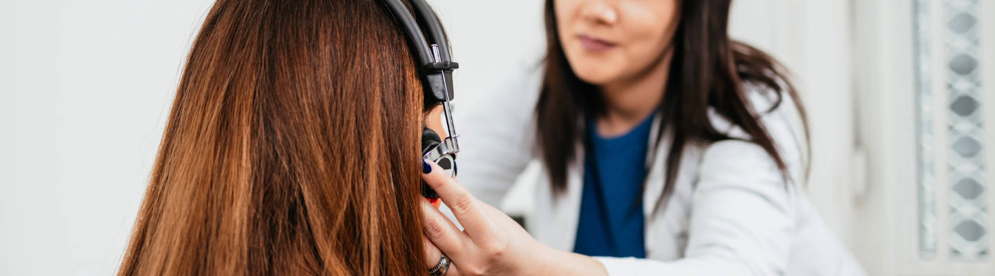 Hand held to ear to hear better