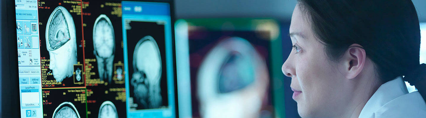 Provider looking at brain scans
