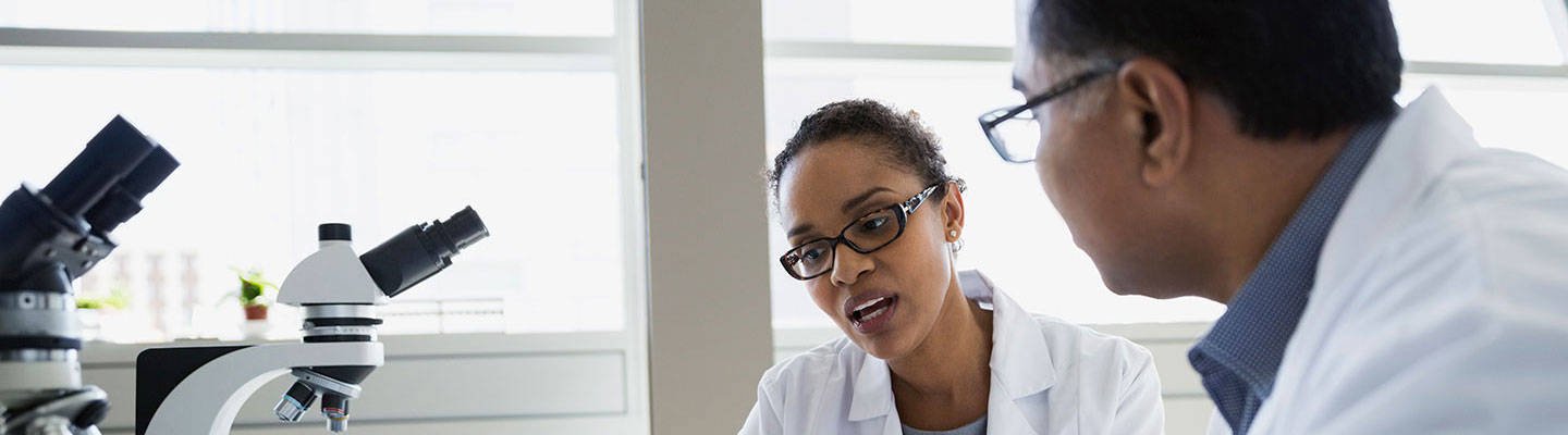 Lab technicians discussing results