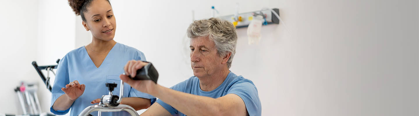 man in occupational therapy exercising his arms