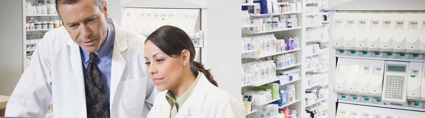 Pharmacists at a computer.
