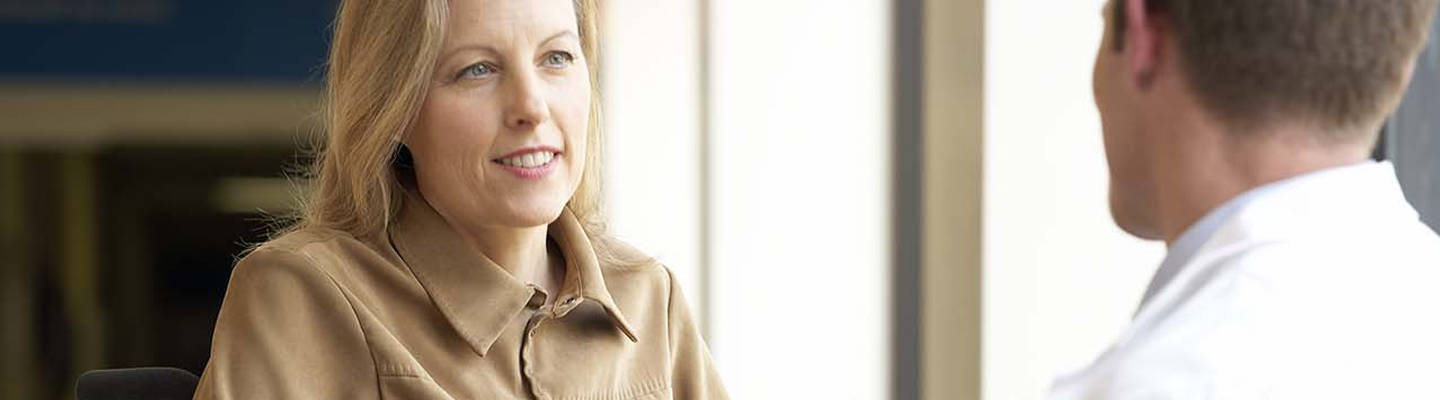 Woman consulting with doctor