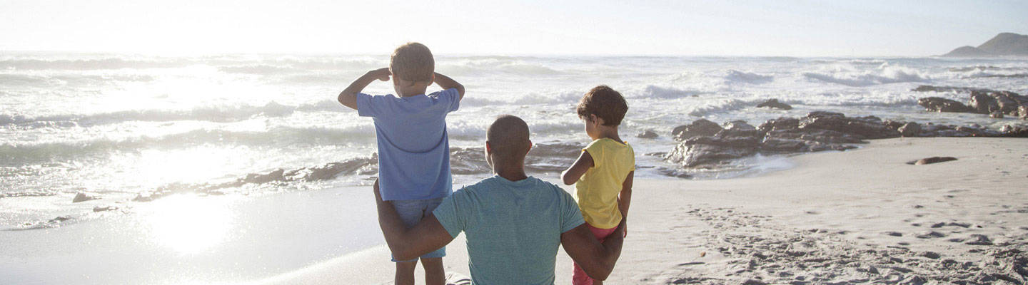 Dad with young sons watching sunrise