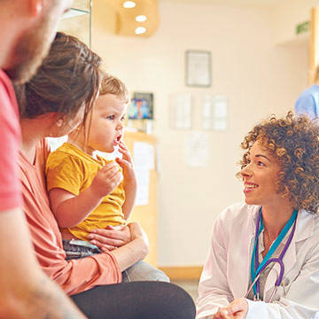 Female Md with Family in Waiting Room Photo of Providence Pediatrics - Sherwood