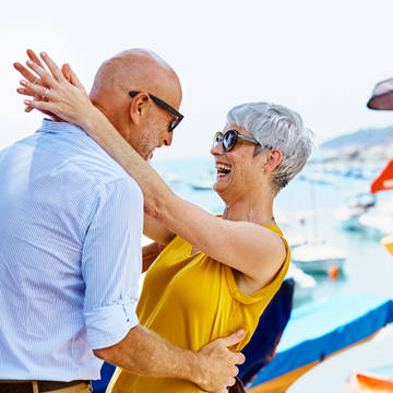 Senior couple embracing at pier Photo of Providence Panorama Clinic