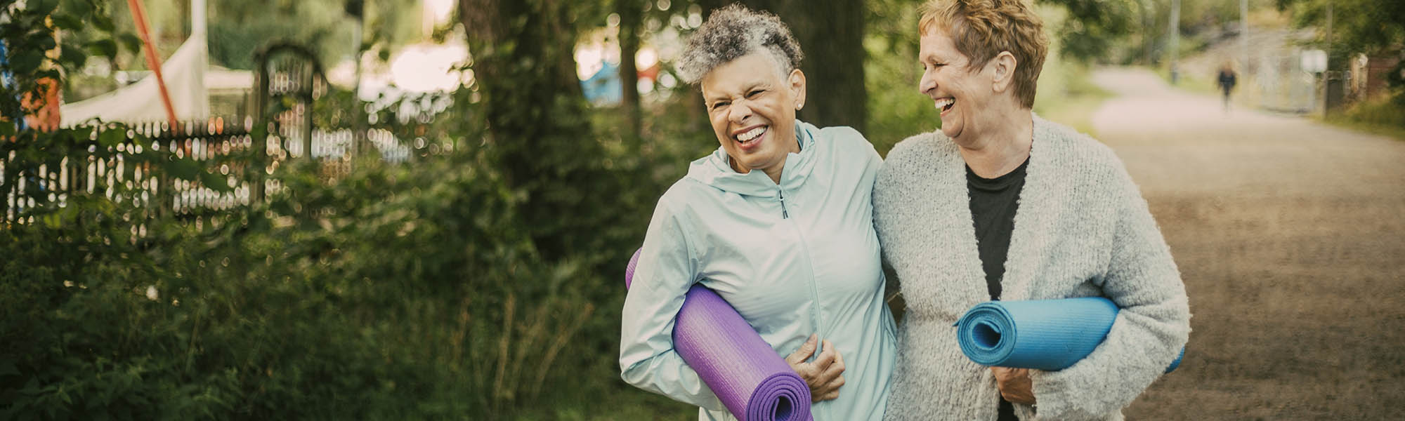 two women walking to yoga class