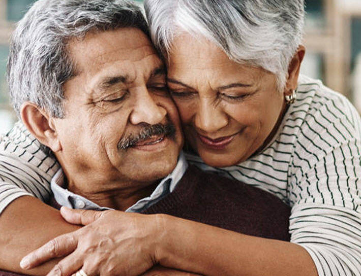 Senior couple hugging