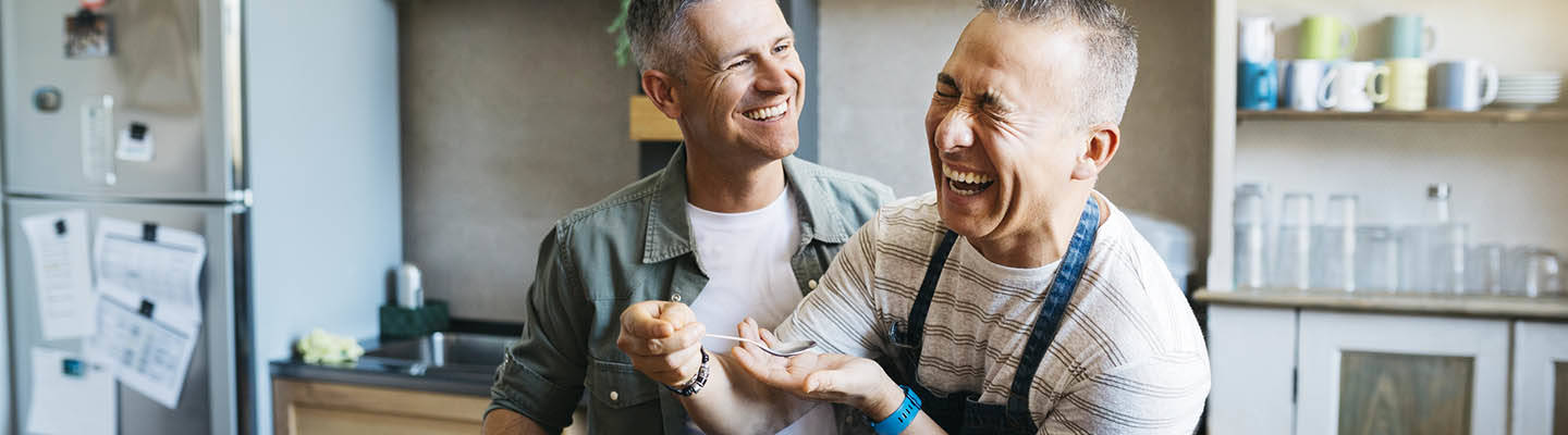Couple making dinner together in kitchen