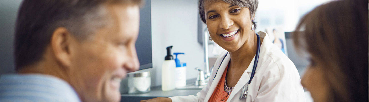 A neurologist consults with a patient