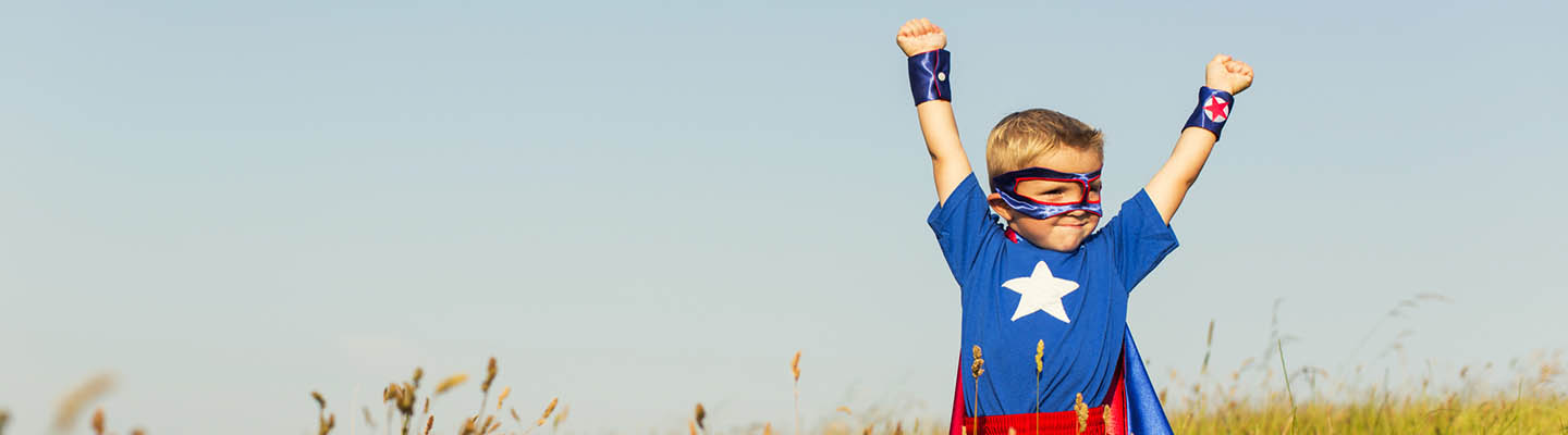 young boy dressed as superhero
