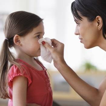mom-and-sick-child-blowing-nose Photo of St. Joseph Heritage Urgent Care – Orange